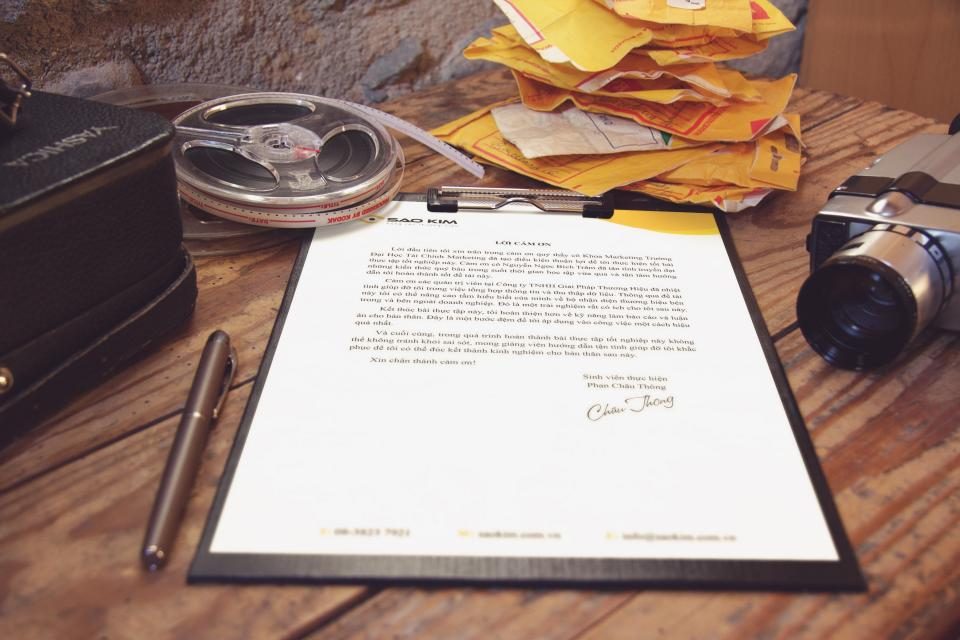 Debt settlement, financial documents and pen on desk