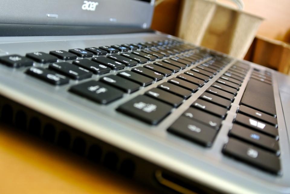 Browsing the internet on a laptop for extra income